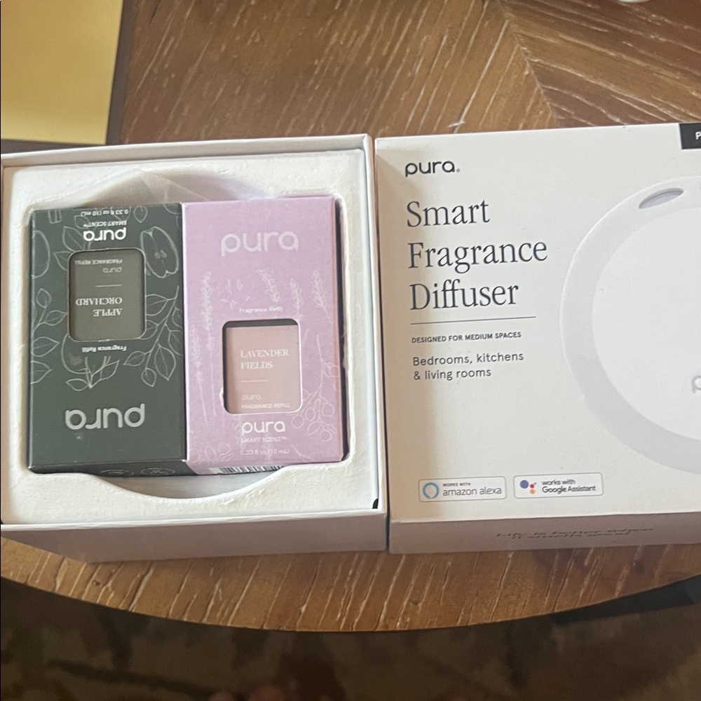 Pura Smart Fragrance Diffuser with 2 scent refills.